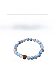Detail of blue crystal beads and square sandalwood bead on a 17cm beaded bracelet