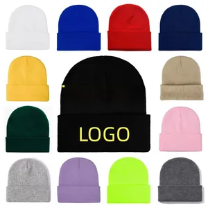 Collection of thirteen colorful knit beanies with cuffed edges shown in a grid layout