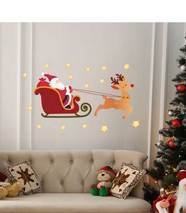 Detail of Santa Claus sleigh and reindeer wall stickers on a cozy living room wall