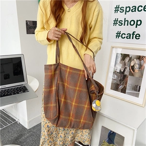 Casual plaid woolen shoulder bag with large capacity shown in a lifestyle setting