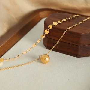Double-layered gold titanium steel necklace with circular sequins and round ball pendant