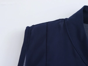 Close-up of shoulder stitching and collar on this navy blue sleeveless chiffon top