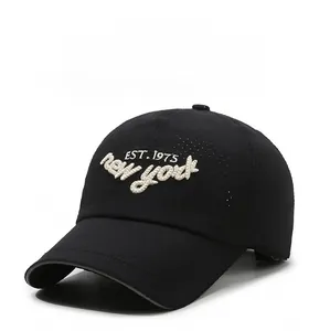 Detail of white New York EST. 1975 embroidery on black breathable quick-dry baseball cap