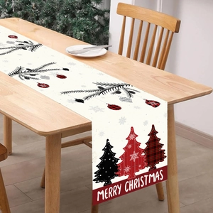 Christmas table runner with red plaid trees and Merry Christmas text on wooden table