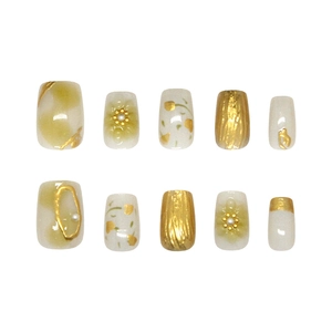 Handmade press-on nails with 3D floral design, pearls, and gold glitter accents
