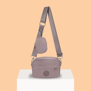 Waterproof nylon crossbody bag in dusty pink with a matching small coin purse