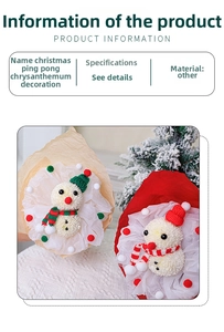 Close-up of a handmade Christmas snowman pom-pom with a knitted red hat and mini scarf