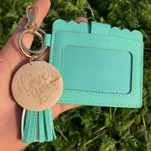 Mint green faux leather multi-slot card holder with tassel and engraved wood charm