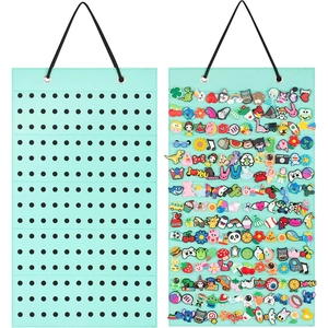 Hanging felt display organizer in mint green showing empty and filled storage slots