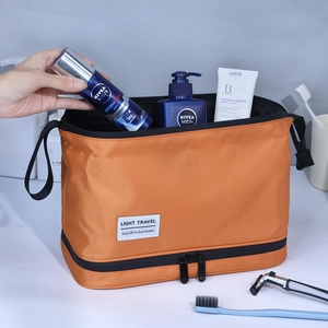 Orange dry-wet separation travel toiletry bag with double compartments and hand strap