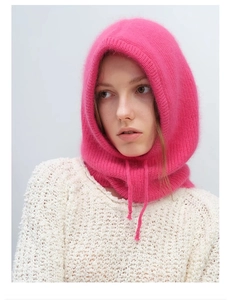 Detail of rose pink knitted Balaclava hood with adjustable drawstring texture
