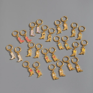 Detailed view of stainless steel hoop earrings with colorful cowboy boot pendants