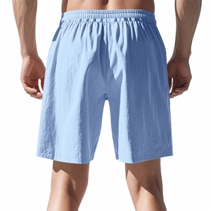 Rear view of men's light blue casual shorts featuring elastic waistband and textured fabric