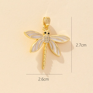 Detailed view of dragonfly pendant with white enamel wings and 2.7x2.6cm dimensions