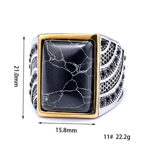 Men's retro stainless steel ring with black turquoise stone in a gold and silver setting