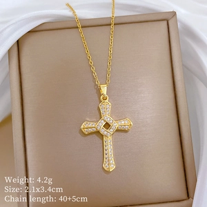 Detail view of rotating cross pendant with dimensions and weight specs on silk
