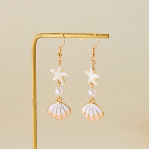 Summer ocean themed starfish and shell drop earrings with pearls on gold hangers