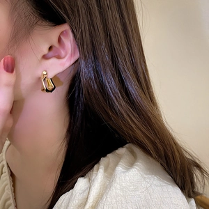 Minimalist gold irregular geometric earrings for women with a sleek wave texture
