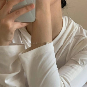 Minimalist S925 sterling silver beaded snake chain bracelet worn on a female wrist