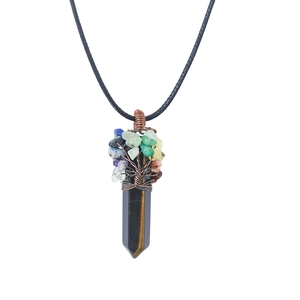 Close-up of tree of life wire-wrapped tiger eye stone pillar pendant with chakra stones