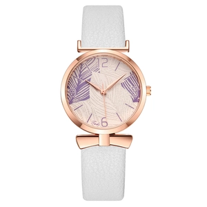 Women's quartz watch with butterfly bow accent and leaf print dial on white leather strap