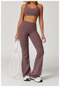 Detail of high-waisted dusty purple flare yoga pants and matching racerback sports bra