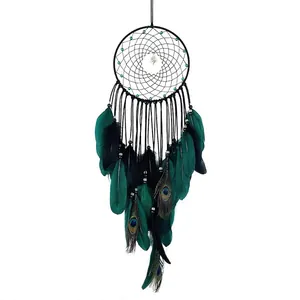 Handmade dream catcher with peacock feathers and beads in elegant Bohemian style