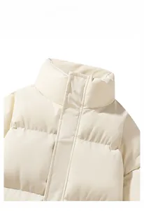 Close-up of cream white puffer jacket featuring horizontal quilting and high windproof collar