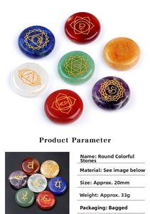 Detail showing 20mm round seven chakra natural stones with engraved golden yoga symbols