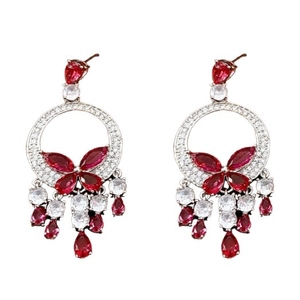 Silver butterfly earrings with red crystal teardrop pendants on a white background