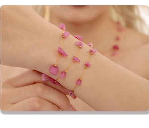 Close-up of pink natural stone multi-layer bracelet with gold stainless steel chain