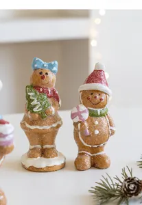 Close-up of resin gingerbread man figurines with glitter details for Christmas decor