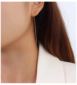 Detail of 18k gold plated long threader earrings showing the sleek bar drop design