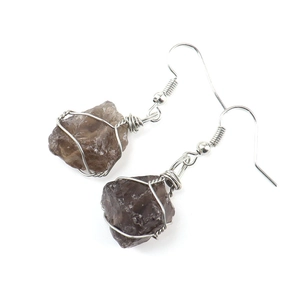 Detail of handmade silver wire wrapped raw smoky quartz crystal dangle earrings for women