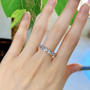 Close-up of S925 sterling silver ring with sparkling heart-shaped zirconia stones