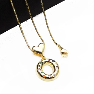Detail of gold-plated necklace with heart link and multi-color zircon round pendant