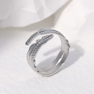 Adjustable silver feather open ring in stainless steel with detailed texture
