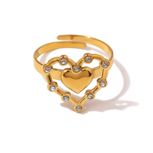 Detail of gold-plated heart ring featuring a crystal-set halo and adjustable open band