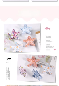 Detail view of starfish hair claws with colorful patterns on fashion magazine background