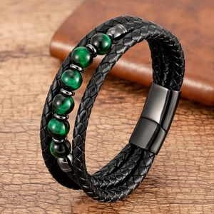 Detail of multi-layer leather bracelet with green beads and magnetic metal clasp