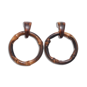 Vintage dark brown resin hoop earrings with bamboo texture on a clean white background