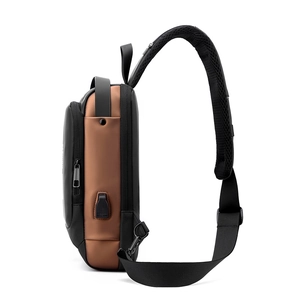 Detailed side view of water-resistant sling bag with USB charging port and padded strap