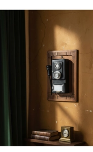 Macro detail of vintage rotary phone with wood frame and matte black finish