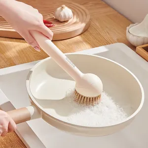 Kitchen dish brush with liquid dispenser and rotating head for cleaning pots and pans