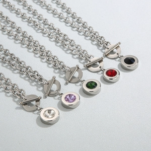 Detail of stainless steel chunky chains with colorful satellite stones and OT clasps