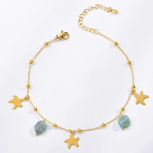 Detail showing golden starfish charms and light blue natural stone beads on a sleek anklet