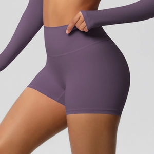 Detail of high-waisted purple yoga shorts with squat-proof fabric and thumb-hole sleeves