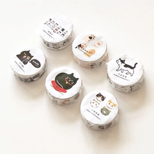 Close-up of 6 cute cat-themed washi tape rolls for scrapbooking and DIY crafts