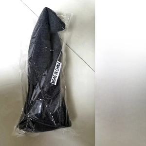 Detail of grey knitted witch hat showing OPP bag packaging and size specifications
