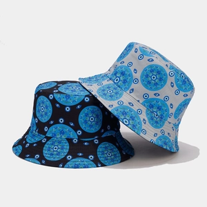 Vintage cotton bucket hat featuring mandala and blue evil eye patterns in black and gray
